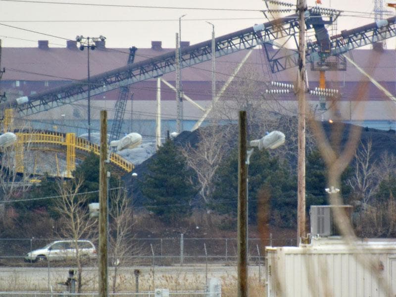Petroleum coke stockpile at an industrial site
